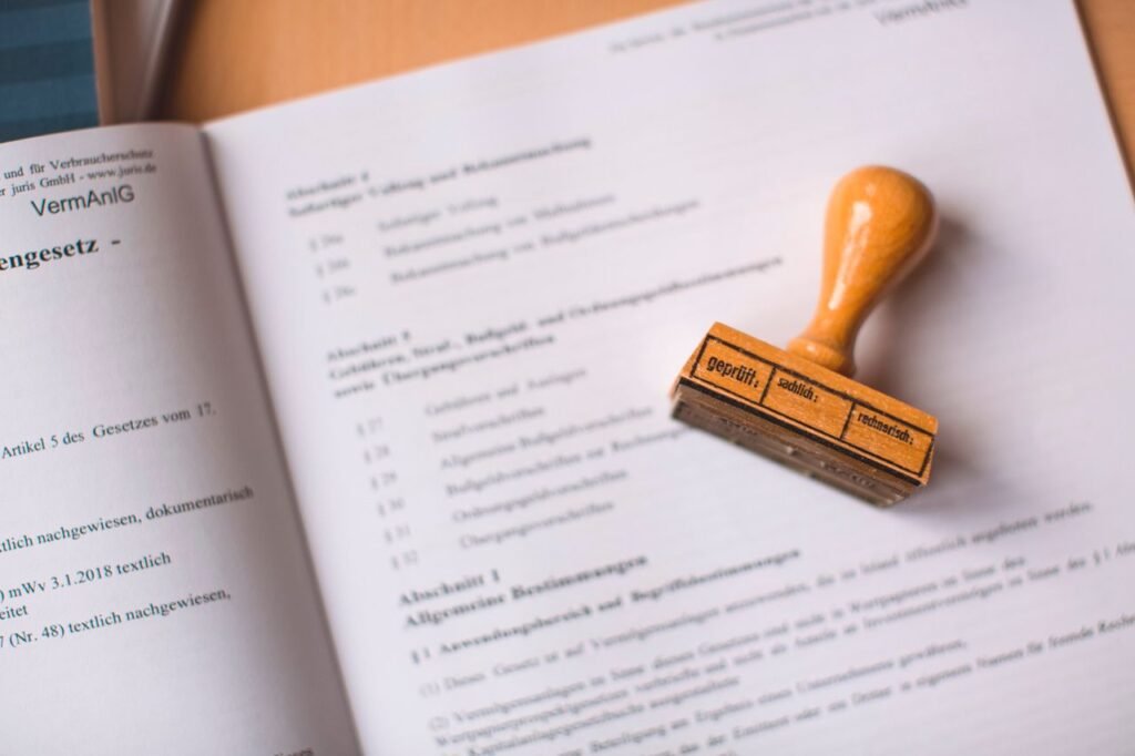 Understanding Estate Planning and Probate: Insights from Heber and Atty. Chris Close-up of a legal document with a wooden stamp placed on top, highlighting verification.